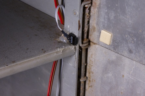The contact switch used to detect the opening, simply glued